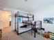 L-Shaped bedroom with bunk beds and access to hallway at 16779 Sunburst Lake St, Wimauma, FL 33598