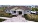 Community center with stone accents and paved walkway at 16779 Sunburst Lake St, Wimauma, FL 33598
