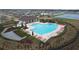 Resort-style pool with ample lounge chairs and a pool house at 16779 Sunburst Lake St, Wimauma, FL 33598