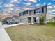 Two-story house exterior, featuring a two-car garage and well-maintained lawn at 16779 Sunburst Lake St, Wimauma, FL 33598