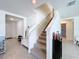 Modern staircase with carpet runner and entryway view at 16779 Sunburst Lake St, Wimauma, FL 33598