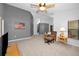 Living area with grey accent wall, comfortable seating, and a ceiling fan at 1728 Allens Ridge N Dr, Palm Harbor, FL 34683