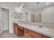 Double vanity bathroom with a shower and tile flooring at 19208 Weymouth Dr, Land O Lakes, FL 34638