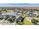 Aerial view of community with lake and homes at 19724 Post Island Loop, Land O Lakes, FL 34638