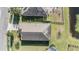 Aerial view of house and surrounding landscape at 19724 Post Island Loop, Land O Lakes, FL 34638