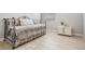 Cozy bedroom with daybed and decorative pillows at 19724 Post Island Loop, Land O Lakes, FL 34638