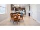 Bright dining area with wooden table and chairs near kitchen at 19724 Post Island Loop, Land O Lakes, FL 34638