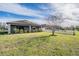 One-story house with covered patio and yard at 19724 Post Island Loop, Land O Lakes, FL 34638