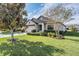 One-story house with garage and manicured lawn at 19724 Post Island Loop, Land O Lakes, FL 34638