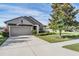 One story house with attached garage and landscaping at 19724 Post Island Loop, Land O Lakes, FL 34638