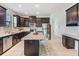 Modern kitchen with stainless steel appliances and granite countertops at 19724 Post Island Loop, Land O Lakes, FL 34638