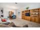 Living room with built-in shelving and a comfortable couch at 19724 Post Island Loop, Land O Lakes, FL 34638