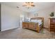 Main bedroom with king-size bed and access to bathroom at 19724 Post Island Loop, Land O Lakes, FL 34638