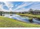 Serene pond with lush greenery and reflections at 19724 Post Island Loop, Land O Lakes, FL 34638