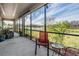 Relaxing screened porch overlooking a lake at 19724 Post Island Loop, Land O Lakes, FL 34638