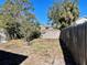 Mostly unlandscaped backyard with a wooden fence at 2105 W Gray St, Tampa, FL 33606