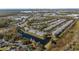 Aerial view of townhouses, pool, and pond at 26614 Castleview Way, Wesley Chapel, FL 33544