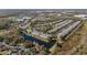 Aerial view of townhome community near highway and retail at 26614 Castleview Way, Wesley Chapel, FL 33544