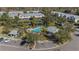 Community pool and surrounding townhouses from above at 26614 Castleview Way, Wesley Chapel, FL 33544