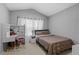 Bedroom with built-in desk and double bed at 26614 Castleview Way, Wesley Chapel, FL 33544