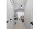 Hallway leading to bedroom with a desk at 26614 Castleview Way, Wesley Chapel, FL 33544