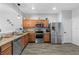 Modern kitchen with stainless steel appliances and granite countertops at 26614 Castleview Way, Wesley Chapel, FL 33544