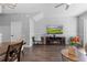 Living room with TV, fireplace, and home office space at 26614 Castleview Way, Wesley Chapel, FL 33544