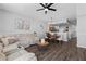 Spacious living room with sectional sofa and dining area view at 26614 Castleview Way, Wesley Chapel, FL 33544