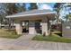 Community mailbox area with covered structure and landscaping at 26614 Castleview Way, Wesley Chapel, FL 33544