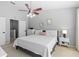 Spacious primary bedroom with large windows, ceiling fan and ample closet space at 26614 Castleview Way, Wesley Chapel, FL 33544