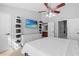 Spacious primary bedroom with large windows, ceiling fan and ample closet space at 26614 Castleview Way, Wesley Chapel, FL 33544