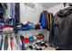 Large primary closet with double hanging rods and shelving at 26614 Castleview Way, Wesley Chapel, FL 33544