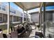 Screened patio with wicker furniture and hot tub view at 26614 Castleview Way, Wesley Chapel, FL 33544