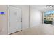 Bright condo entry with white door and tile floor at 301 Cordova Grn, Seminole, FL 33777