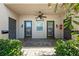 Condo entry with three doors and a tiled floor at 301 Cordova Grn, Seminole, FL 33777