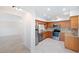Condo kitchen with wood cabinets, granite counters, and stainless steel appliances at 301 Cordova Grn, Seminole, FL 33777