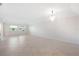 Bright living room featuring tile floors and a large chandelier at 301 Cordova Grn, Seminole, FL 33777