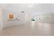 Spacious condo living room with tile floors and lots of natural light at 301 Cordova Grn, Seminole, FL 33777