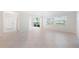 Bright and airy condo living room with tile floors and large windows at 301 Cordova Grn, Seminole, FL 33777