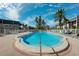 Inviting community pool with ample lounge chairs at 301 Cordova Grn, Seminole, FL 33777