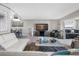 Open concept living room and dining area with large TV and comfortable seating at 3010 59Th S St # 304, Gulfport, FL 33707
