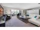 Modern living room with white sectional sofa, large TV, and ample natural light at 3010 59Th S St # 304, Gulfport, FL 33707