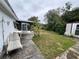 Large backyard with a patio and mature trees at 3722 Haven Dr, New Port Richey, FL 34652