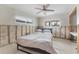 A bedroom with a bed, undergoing renovation with exposed walls at 3910 Americana Dr, Tampa, FL 33634