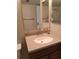Bathroom with single sink vanity and mirror at 400 Island Way # 1508, Clearwater Beach, FL 33767
