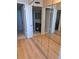 Mirrored bedroom closets and light wood-look floors at 400 Island Way # 1508, Clearwater Beach, FL 33767