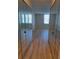 Bright bedroom with mirrored closets and wood-look floors at 400 Island Way # 1508, Clearwater Beach, FL 33767