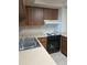 Kitchen with double sink, stove and cabinets at 400 Island Way # 1508, Clearwater Beach, FL 33767