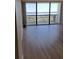 Living room with wide sliding glass doors offering scenic water views at 400 Island Way # 1508, Clearwater Beach, FL 33767