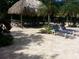 Relaxing patio area with lounge chairs and a thatched roof at 400 Island Way # 1508, Clearwater Beach, FL 33767
